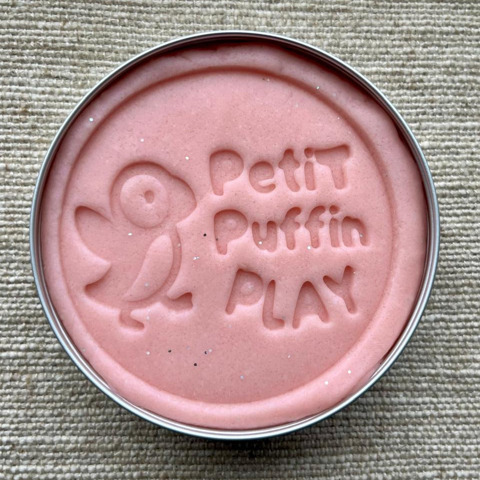 a tin of handmade pink playdough with biodegradable glitter