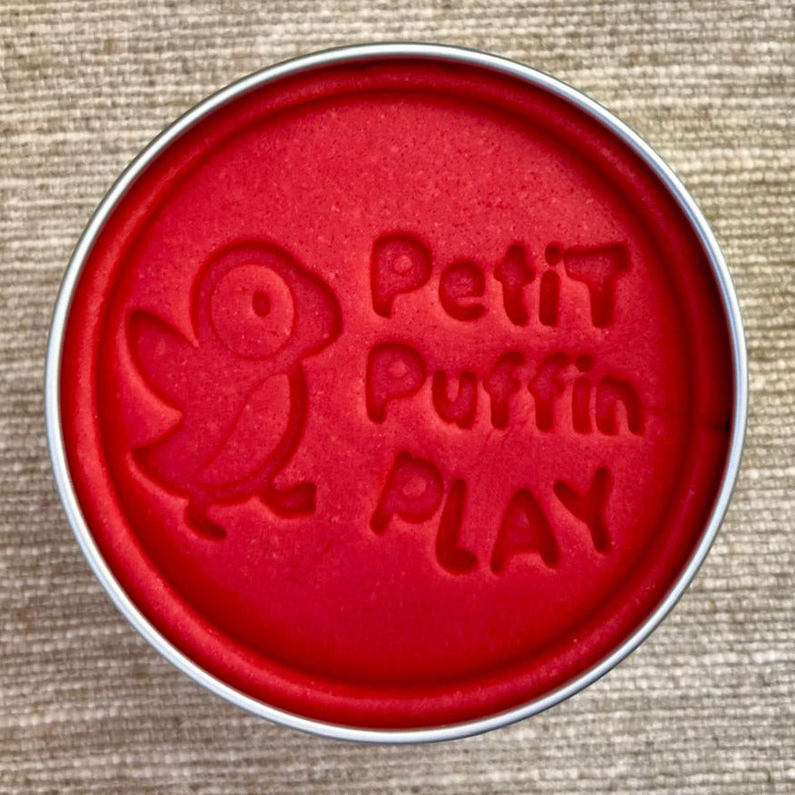 a tin of handmade red playdough